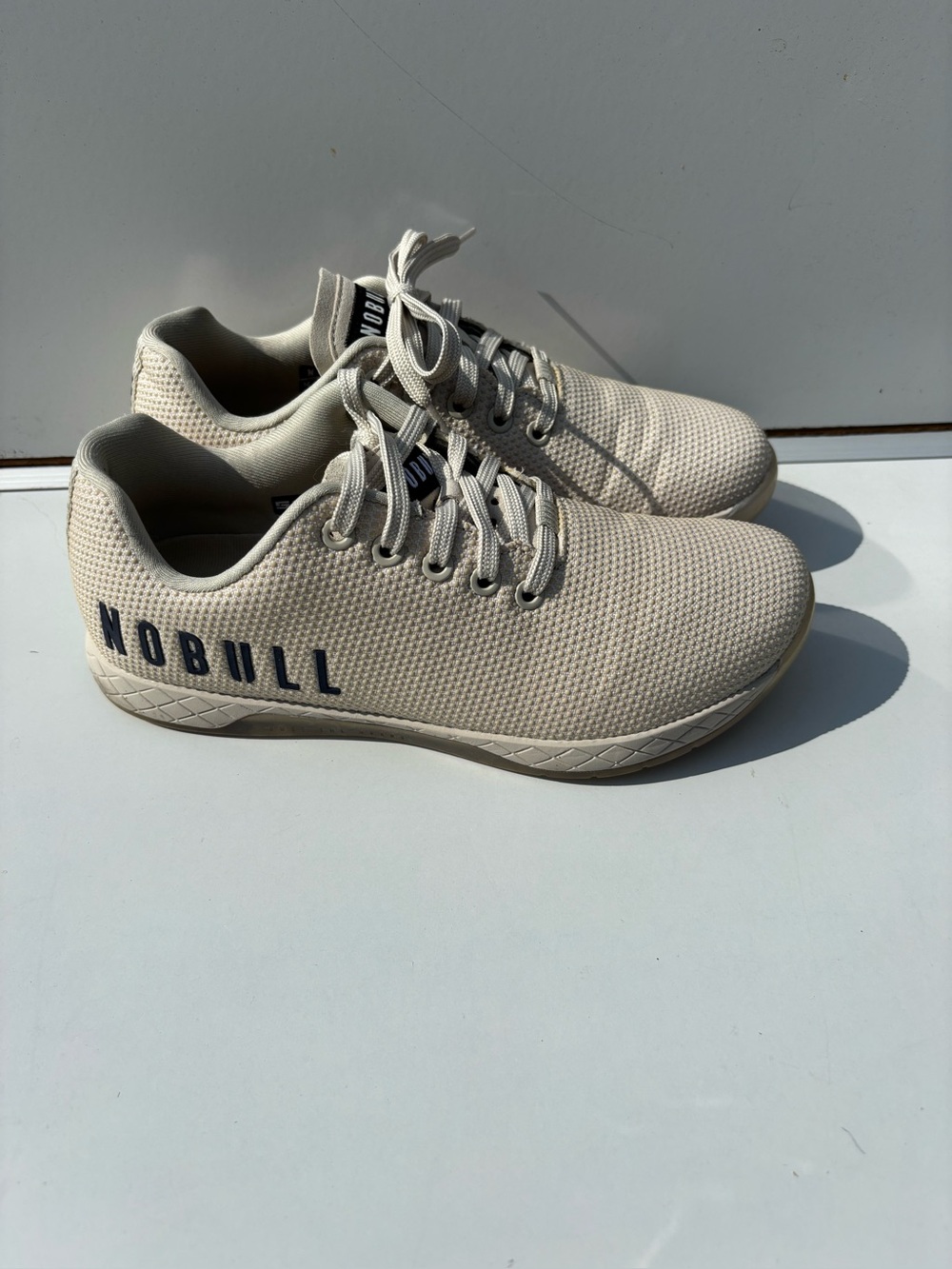 NOBULL Women’s Trainer in Beige with Navy Logo